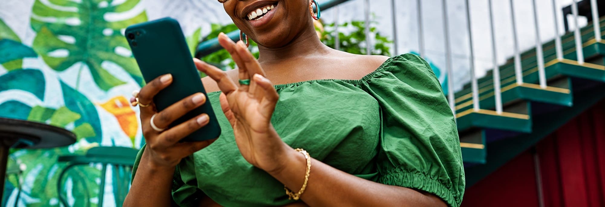 A business owner reading a message on her phone